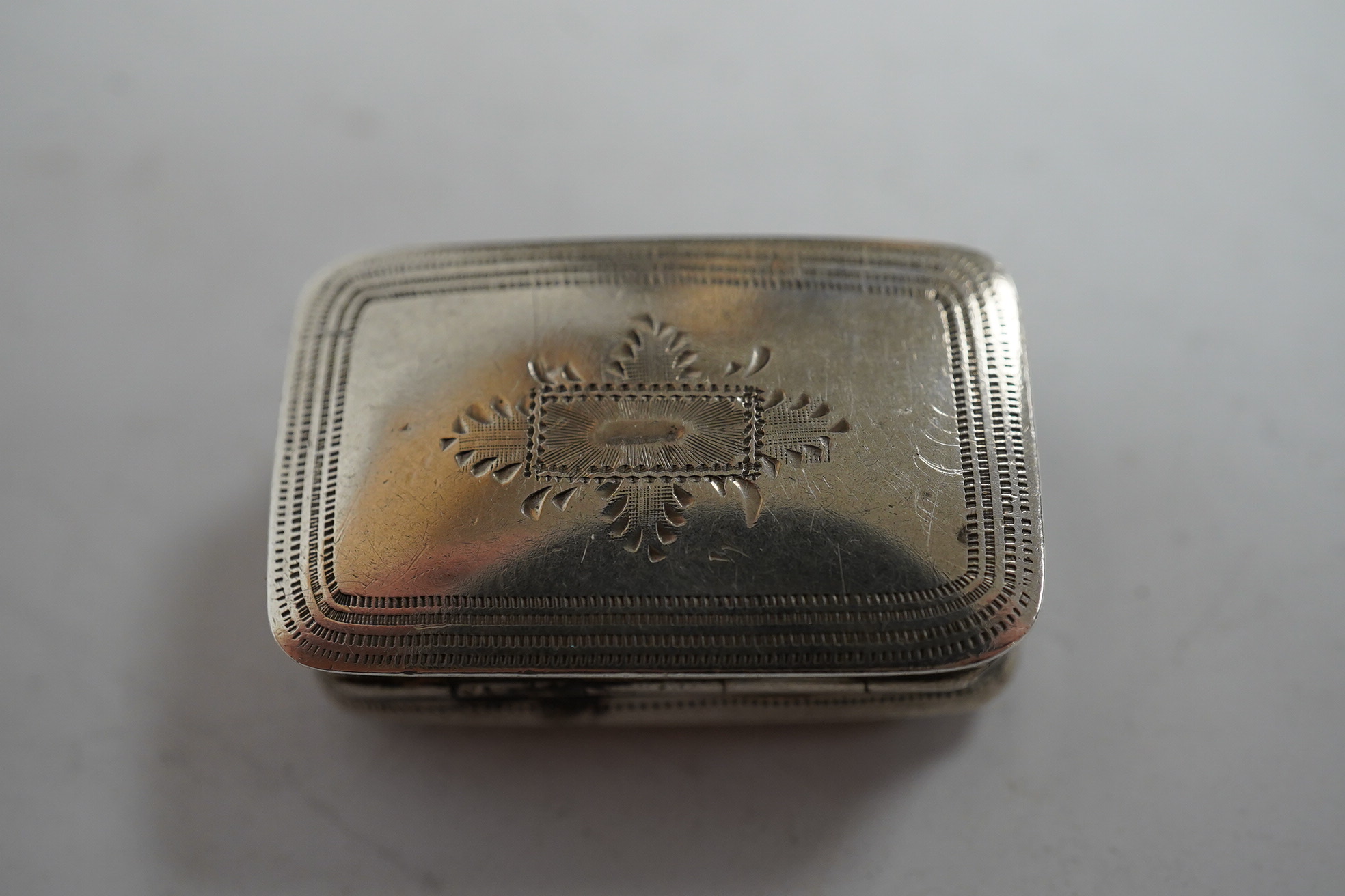 A George IV engraved silver rectangular vinaigrette, Joseph Wilmore, Birmingham, 1829, 26mm. Condition - fair to good